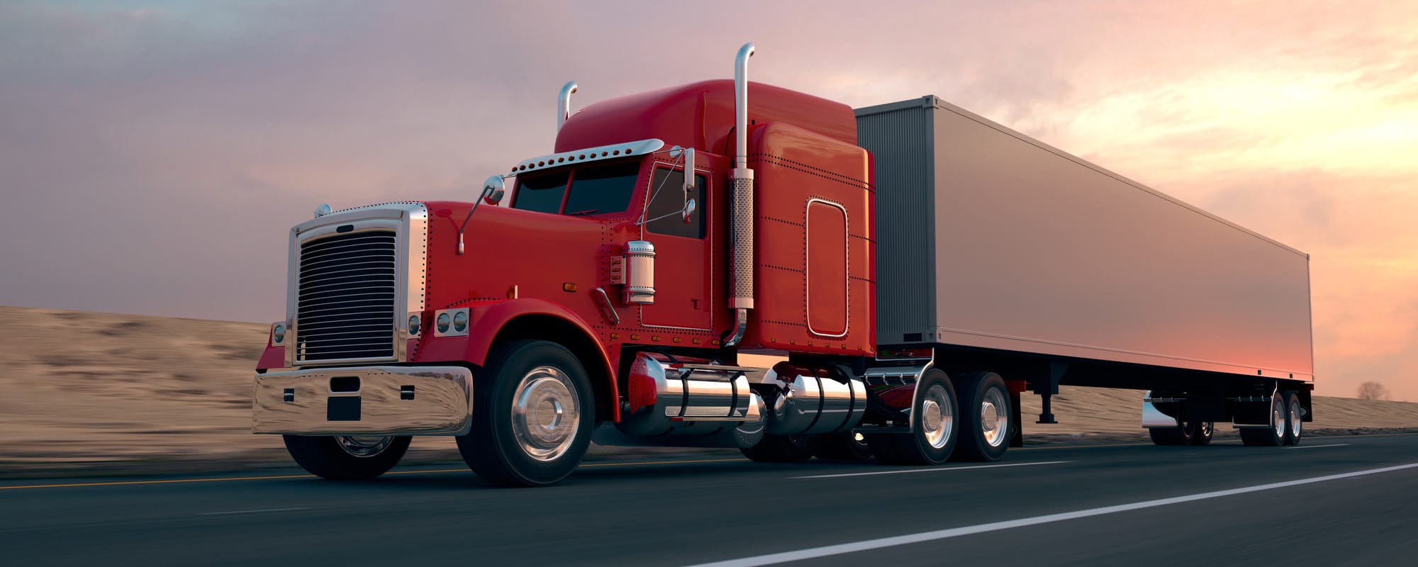 Image of tractor trailer driving with the sun setting in the background